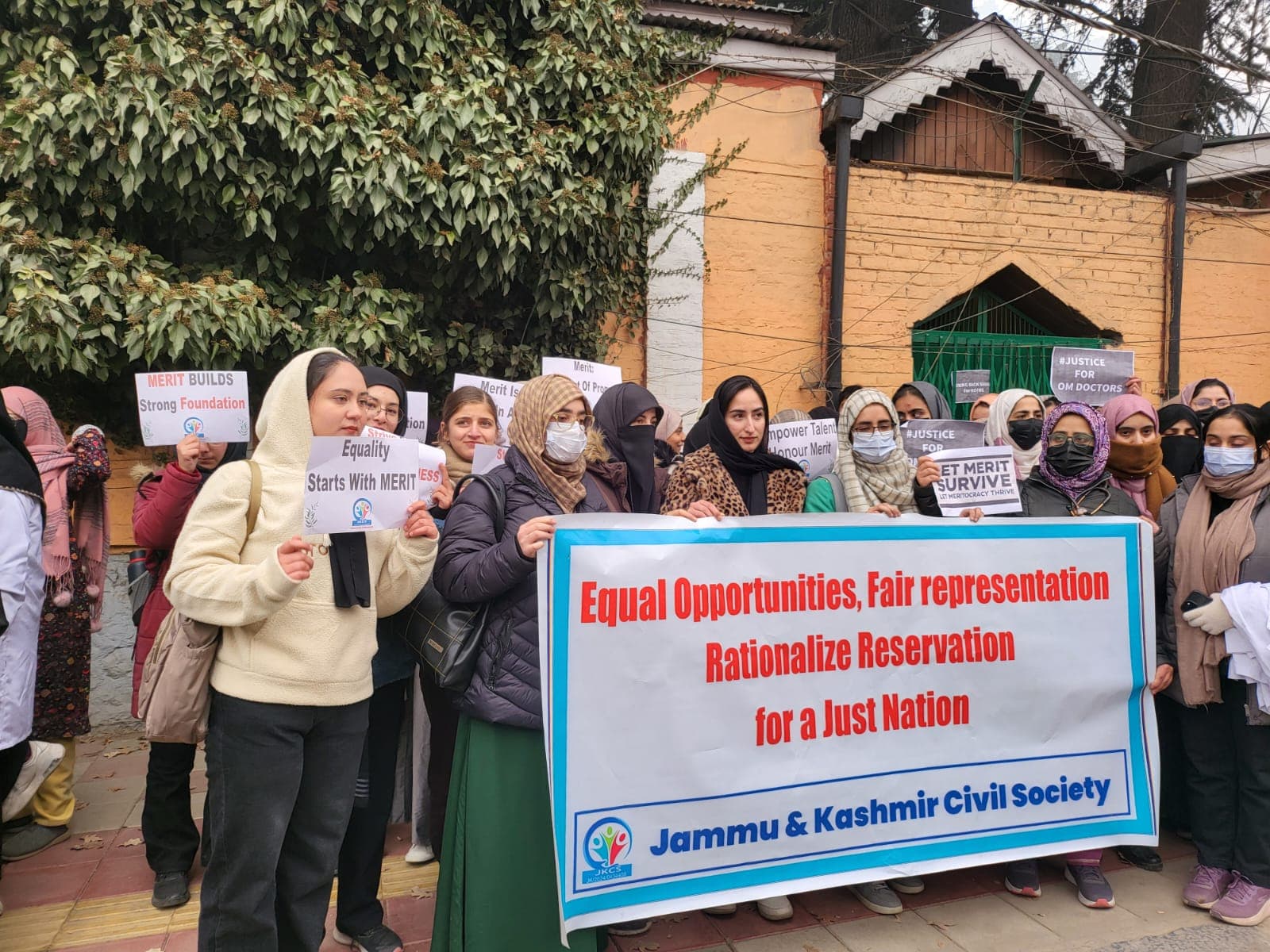 JKCS members at a public rally for merit-based reform